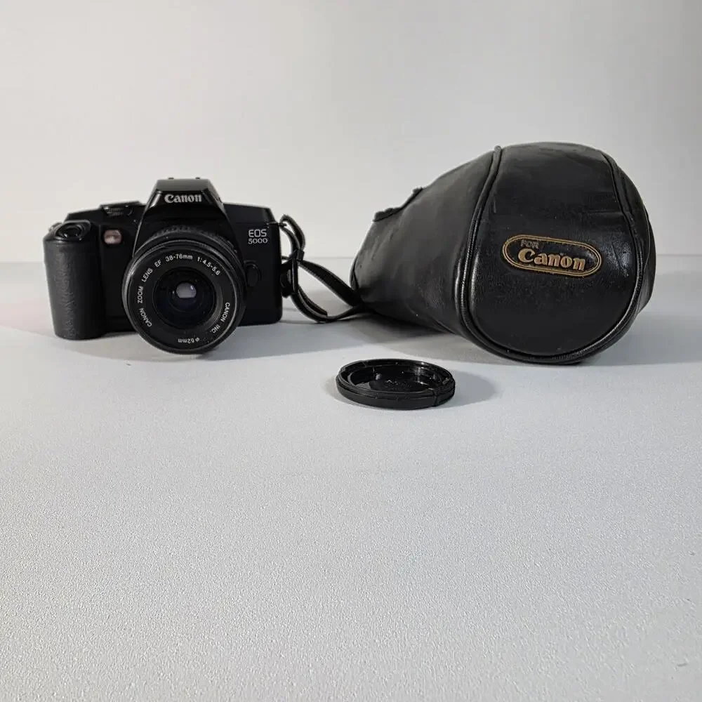 Canon EOS 5000 with 38-76mm EF zoom, UV filter, strap